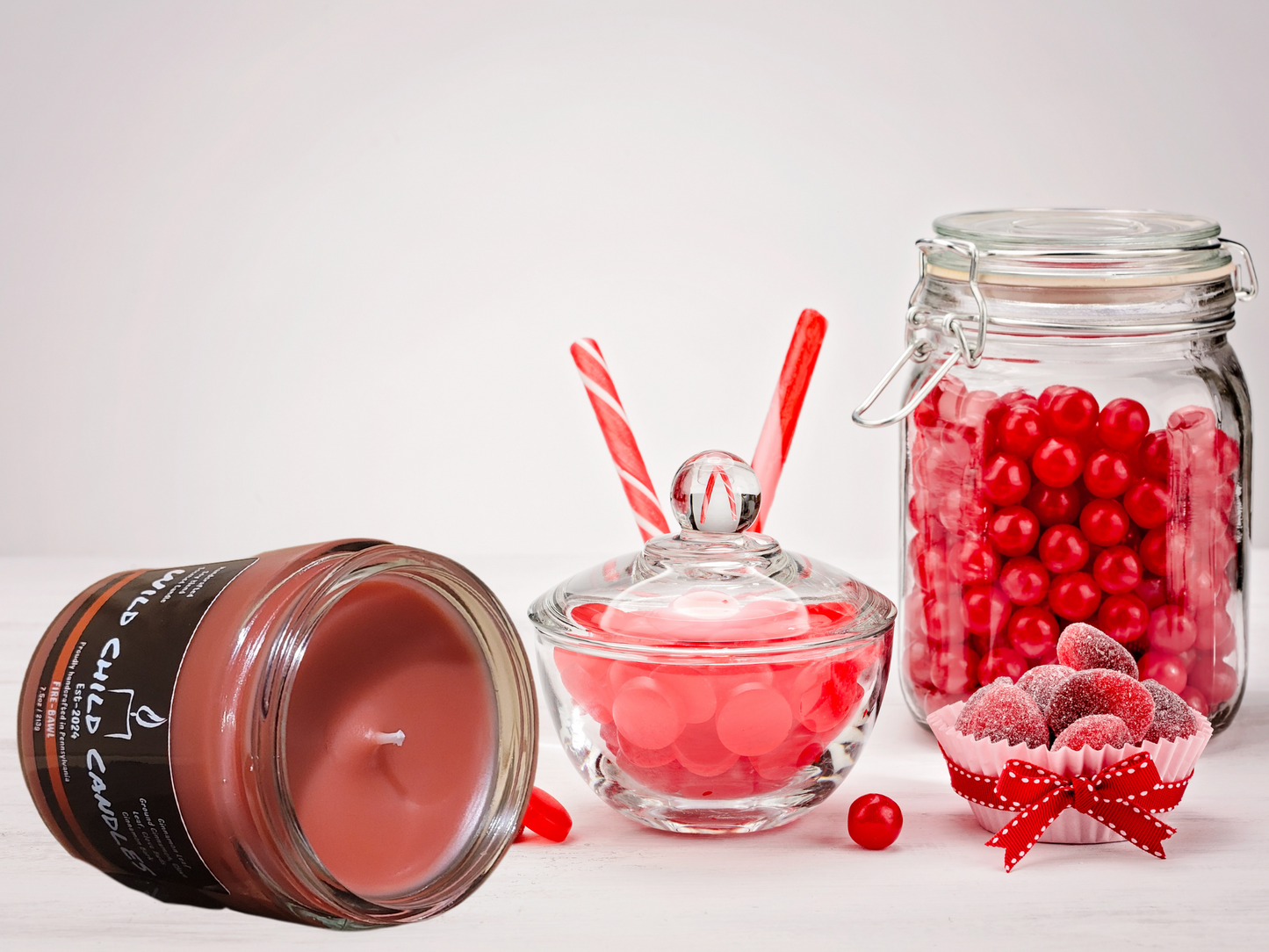 Top view of a small red candle with a funny name from Wild Child Candles.